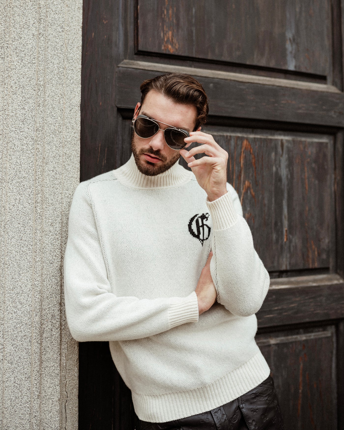 White knitted turtleneck sweater with logo