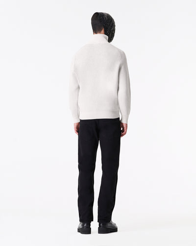 White knitted turtleneck sweater with logo